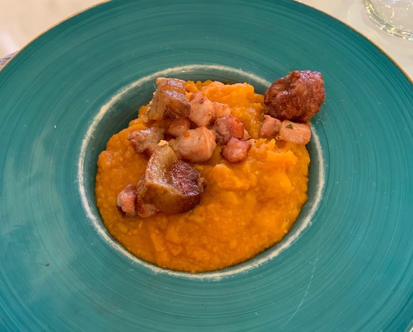 Garlic and paprika potatoes with chorizo and pancetta (Patatas revolcanas) in Castilla y León